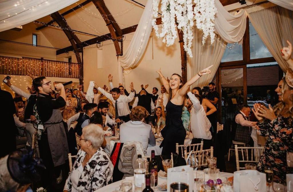 singing waiters wedding guests