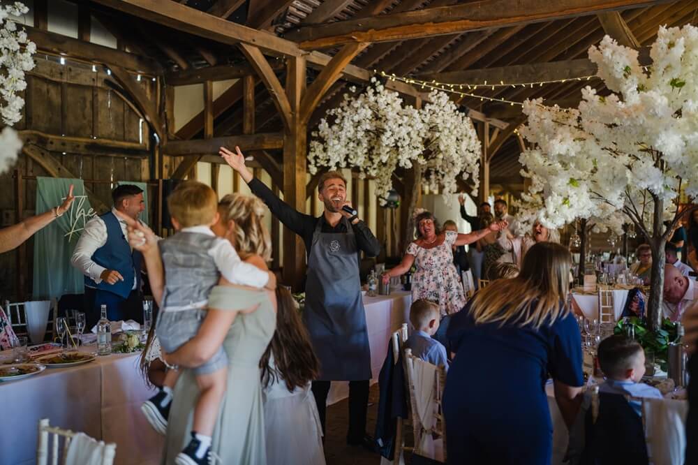Singing Waiters performing at a wedding and getting all the guests up on their feet.