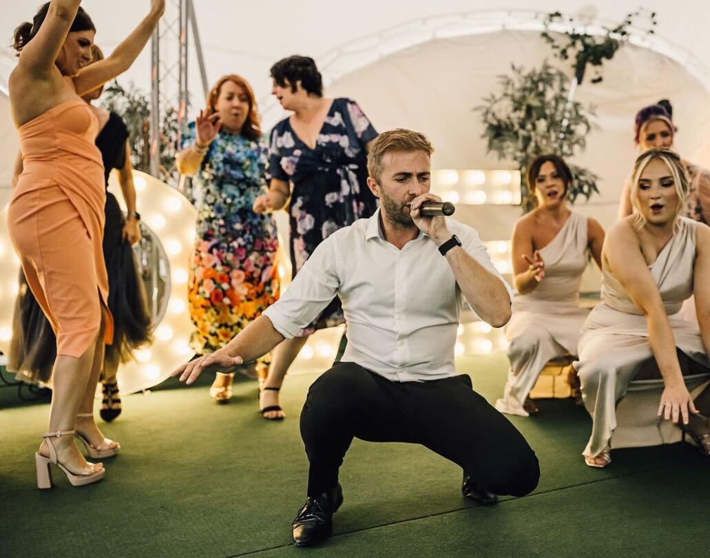 Silver Service Singing Waiter performs with bridesmaids and guests