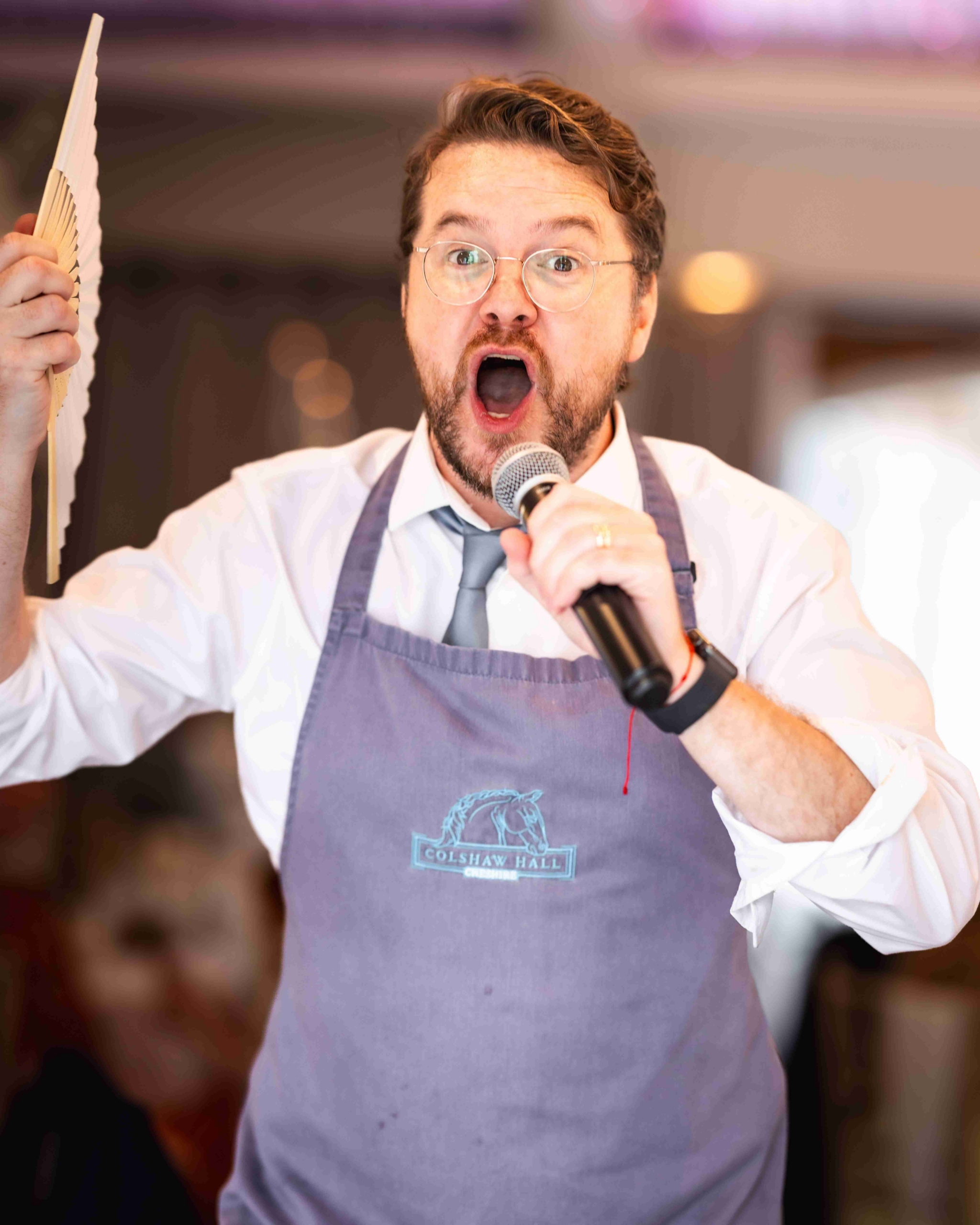 Singing Waiter reveals his performance to unsuspecting guests